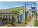 Charming restaurant exterior with inviting outdoor seating, vibrant landscaping, and a quaint atmosphere in an urban area at 33436 Seattle Slew Dr, Sorrento, FL 32776