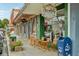 Charming shops line the street with sidewalk seating under awning strung with decorative lighting at 33436 Seattle Slew Dr, Sorrento, FL 32776