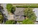 An aerial view of the house's roof, driveway, and surrounding greenery at 3344 Quailwest Ct, Orlando, FL 32812