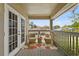 Charming balcony with comfortable seating, a vibrant rug, and a serene view at 3344 Quailwest Ct, Orlando, FL 32812