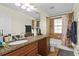 Bathroom features a granite countertop vanity with a shower and tub combo at 3344 Quailwest Ct, Orlando, FL 32812