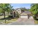 Charming two-story home with a three-car garage and a landscaped front yard at 3344 Quailwest Ct, Orlando, FL 32812