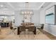 Elegant dining room with modern lighting, wood-look tile floors, stylish decor and modern accents at 3375 Hanging Tide St, Winter Garden, FL 34787