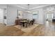 Elegant dining room with modern lighting, wood-look tile floors, stylish decor and modern accents at 3375 Hanging Tide St, Winter Garden, FL 34787
