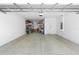 Spacious two car garage with epoxy floors, storage, and a pedestrian door at 3375 Hanging Tide St, Winter Garden, FL 34787