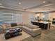 Open concept living space with stylish furnishings, modern decor, and a view into the adjacent kitchen at 3375 Hanging Tide St, Winter Garden, FL 34787