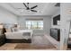 Relaxing main bedroom with ceiling fan, a padded headboard and a window overlooking the backyard at 3375 Hanging Tide St, Winter Garden, FL 34787