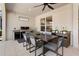Outdoor dining area with grill, counter space, and a ceiling fan for comfort at 3375 Hanging Tide St, Winter Garden, FL 34787