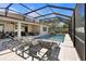 Screened pool area featuring a refreshing pool and comfortable lounge chairs at 3375 Hanging Tide St, Winter Garden, FL 34787