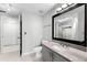 Bathroom features a modern vanity, framed mirror, and tiled floors at 3384 Corona Village Way # 202, Orlando, FL 32835