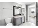 Bathroom features a modern vanity, framed mirror, and tiled floors at 3384 Corona Village Way # 202, Orlando, FL 32835