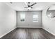 Bright bedroom features wood-look floors, two windows, and a ceiling fan at 3384 Corona Village Way # 202, Orlando, FL 32835