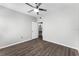 Neutral bedroom features an attached bathroom with wood-look floors at 3384 Corona Village Way # 202, Orlando, FL 32835