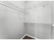 An organized walk-in closet with multiple shelves for optimal storage at 3384 Corona Village Way # 202, Orlando, FL 32835