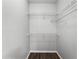 Walk-in closet features wire shelving and wood-look floors at 3384 Corona Village Way # 202, Orlando, FL 32835