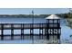 Community dock on the lake, perfect for fishing and enjoying waterfront sunsets at 3384 Corona Village Way # 202, Orlando, FL 32835