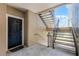 Exterior entrance featuring unit 202, a black door, and metal stairs at 3384 Corona Village Way # 202, Orlando, FL 32835