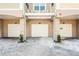 Condominium garages with individual unit letters and covered parking, enhancing convenience at 3384 Corona Village Way # 202, Orlando, FL 32835
