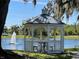 Charming gazebo overlooking the lake, providing a relaxing retreat in the community at 3384 Corona Village Way # 202, Orlando, FL 32835