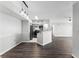 Open-concept kitchen featuring stainless steel appliances and a granite countertop bar at 3384 Corona Village Way # 202, Orlando, FL 32835