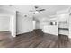 Spacious living room with an open floor plan, dark wood floors, and recessed lighting at 3384 Corona Village Way # 202, Orlando, FL 32835