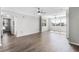 Bright living room with large windows, ceiling fans, and hardwood floors at 3384 Corona Village Way # 202, Orlando, FL 32835