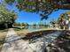 This is a picture of a pond that is surrounded by walking paths at 3384 Corona Village Way # 202, Orlando, FL 32835