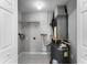 Utility room featuring a hot water heater and storage shelf at 3384 Corona Village Way # 202, Orlando, FL 32835
