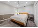 Comfortable bedroom with neutral tones, carpeted floors, natural light, and a ceiling fan at 3400 Park Grove Ct, Longwood, FL 32779