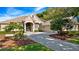 Charming home showcasing mature landscaping, a concrete driveway, and an attached two car garage at 3400 Park Grove Ct, Longwood, FL 32779