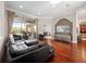 Bright and spacious living area with hardwood floors, comfortable seating, and sliding doors leading to the outdoor patio at 3400 Park Grove Ct, Longwood, FL 32779