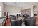 Bright living room with hardwood floors and a round table surrounded by chairs, and a cabinet at 3400 Park Grove Ct, Longwood, FL 32779