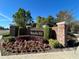 Community entrance sign with beautiful landscaping and brick columns, located in Remington Park at 437 Wilmington Cir, Oviedo, FL 32765