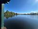 Picturesque lake view from a community gazebo, showcasing the natural beauty of the surroundings at 437 Wilmington Cir, Oviedo, FL 32765