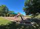Community playground with slide, swing set, and covered area for a fun and safe recreational space at 437 Wilmington Cir, Oviedo, FL 32765