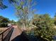 Scenic pond featuring a wooden bridge and lush vegetation, enhancing the community's natural beauty at 437 Wilmington Cir, Oviedo, FL 32765