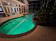 Gorgeous pool featuring ambient lighting, surrounded by lush landscaping for ultimate relaxation and privacy at 437 Wilmington Cir, Oviedo, FL 32765