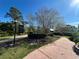Well maintained community walking path with landscaping and a sign that reads 'A Great Place To Live' at 437 Wilmington Cir, Oviedo, FL 32765