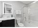 Modern bathroom with a sleek vanity, illuminated mirror, and a glass-enclosed shower/tub combination at 4445 Le Reve Ct, Kissimmee, FL 34746