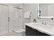 Sleek bathroom with a glass-enclosed shower, modern vanity, and stylish fixtures at 4445 Le Reve Ct, Kissimmee, FL 34746