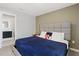 Cozy bedroom featuring a comfortable bed, stylish headboard, and ensuite bathroom access at 4445 Le Reve Ct, Kissimmee, FL 34746