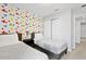 Another view of bedroom with twin beds, decorative wall, and closet for ample storage at 4445 Le Reve Ct, Kissimmee, FL 34746