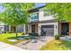 Charming two-story home with a brick driveway and one-car garage, surrounded by lush green landscaping at 4445 Le Reve Ct, Kissimmee, FL 34746