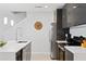 Modern kitchen with a center island, sleek cabinetry, stainless steel appliances, and pendant lighting at 4445 Le Reve Ct, Kissimmee, FL 34746