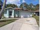 Charming single-story home features a two-car garage and well-maintained landscaping at 4798 Windwood Dr, Kissimmee, FL 34746