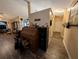 Inviting hallway with stylish wood floors and views into the living spaces at 4798 Windwood Dr, Kissimmee, FL 34746