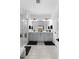 Elegant bathroom featuring dual vanities, a glass-enclosed shower, and modern fixtures at 4911 Shady Pines Dr, St Cloud, FL 34772