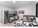Bedroom with two beds and a gray bunk bed. The room has neutral colors and artwork at 4911 Shady Pines Dr, St Cloud, FL 34772