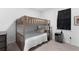 Neutral colored bunk bed with a small nightstand in a cozy bedroom space at 4911 Shady Pines Dr, St Cloud, FL 34772