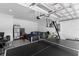 Spacious garage with a ping pong table, basketball hoop, and living area at 4911 Shady Pines Dr, St Cloud, FL 34772